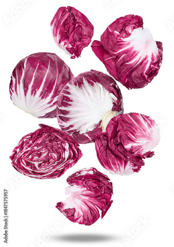 high angle photograph of fresh, vibrant radicchio heads and cut halves on a dark background, perfect for illustrating healthy eating habits and diets.