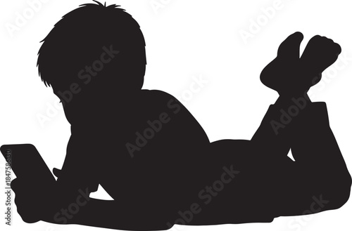 Silhouette of a young boy lying on his stomach looking at a smartphone in his hands representing modern childhood technology use and leisure activities also transparent background