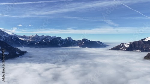 Wallpaper Mural Churfirsten alps, Walensee, Amden, Switzerland aerial drone view above sea of clouds, vast alpine horizon and calm winter atmosphere. Torontodigital.ca