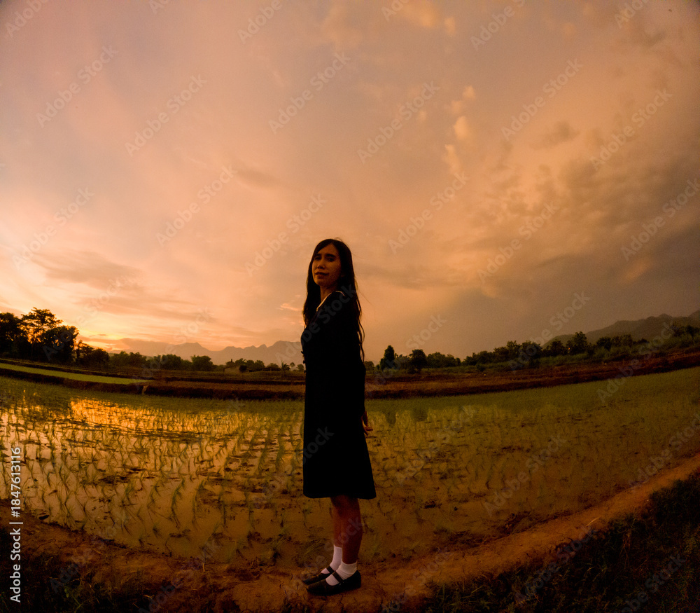 Fototapeta premium Silhouette of an Asian woman in the afternoon. Introverted woman. World Introvert Day.