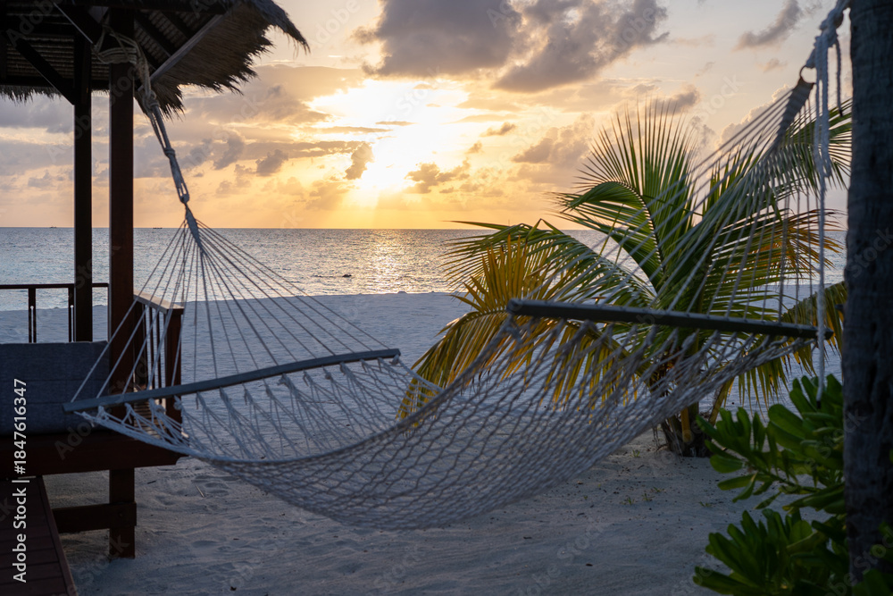 Hammock on a tropical beach, a symbol of relaxation and island life.