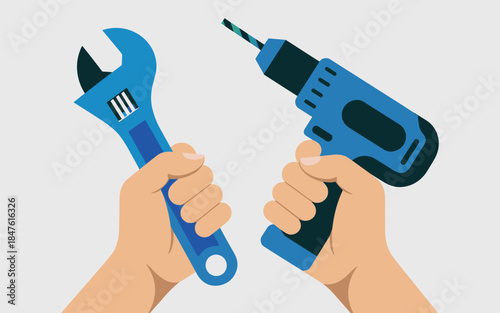 Hands holding a wrench and a drill in a working environment from a straight-on viewpoint
