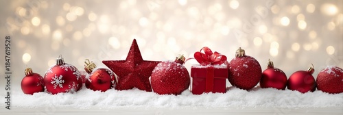 Festive Red Ornaments on Snow with Sparkling Bokeh Background