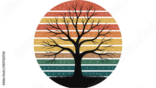 Bare tree silhouette against colorful sunset with snowflakes