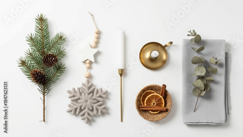 Christmas holiday decoration flat lay with pine sprig snowflake and dried orange slices.