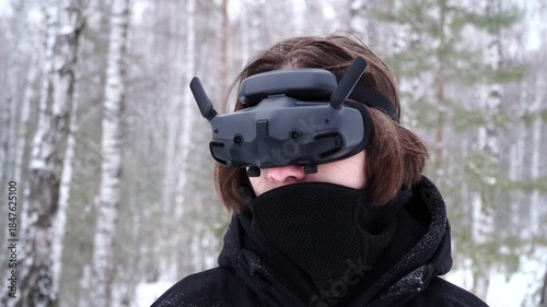 pilot controlling fpv drone through googles