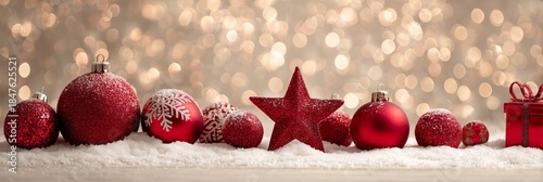 Festive Red Ornaments on Snow with Sparkling Bokeh Background