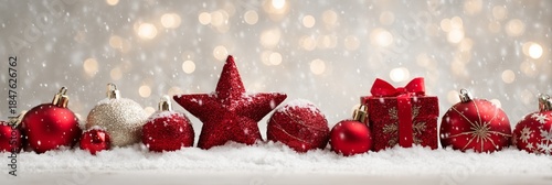 Festive Red Ornaments on Snow with Sparkling Bokeh Background