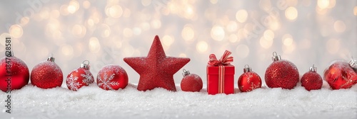 Festive Red Ornaments on Snow with Sparkling Bokeh Background