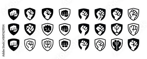 Set of black and white fist icons on shields for strength and po
