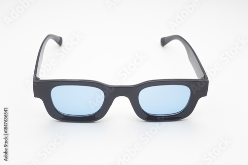 Trendy Black Rectangular Sunglasses with Blue Tinted Lenses Isolated on White Background