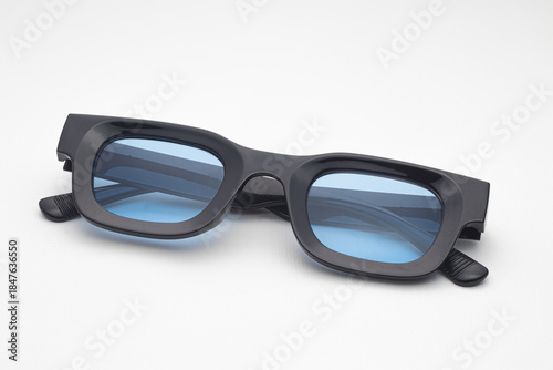 Trendy Black Rectangular Sunglasses with Blue Tinted Lenses Isolated on White Background