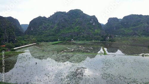 Asia, Ninh Bình and Tam Coc  in the Red River Delta region of Vietnam -  limestone karst formations emerge from rice paddies and rivers 