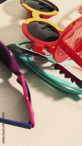 Assorted colorful glasses arranged for a lively party celebration in a cozy indoor location