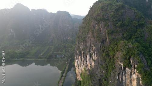 Asia, Ninh Bình and Tam Coc  in the Red River Delta region of Vietnam -  limestone karst formations emerge from rice paddies and rivers 
