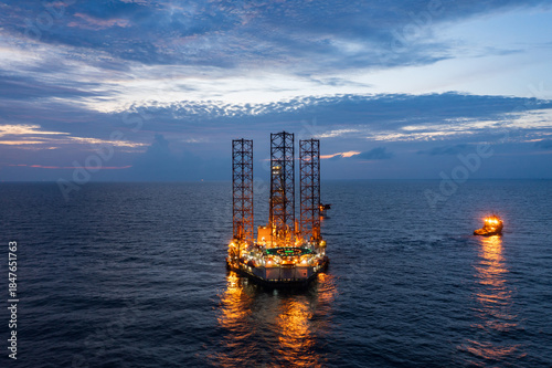 Принти на полотні Aerial view of offshore jack up rig during rig move in sunset time