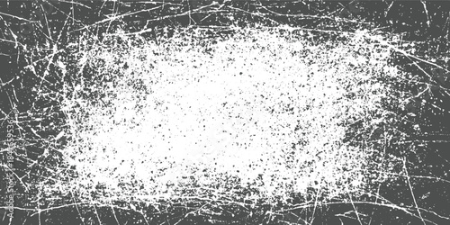 Grunge texture with white speckles and scratches on dark gray background