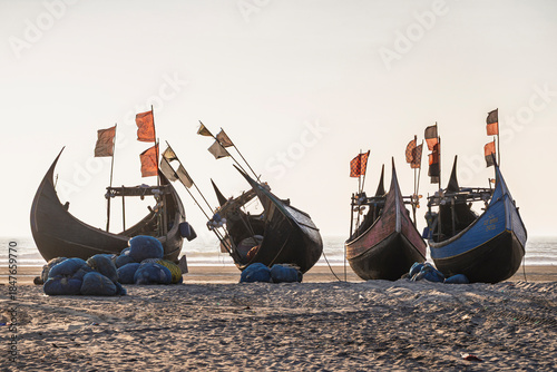 Fotografie Seascape view before sunset of traditional wooden fishing boats known as moon bo