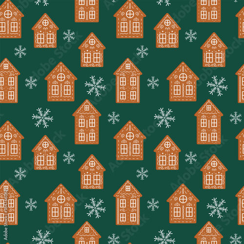 Festive seamless Christmas pattern featuring traditional gingerbread houses decorated with white icing and snowflakes on a dark green background. Perfect for holiday textiles, wrapping paper. Vector