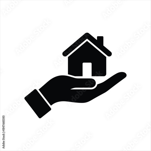 Hand holding a house icon representing real estate and property ownership