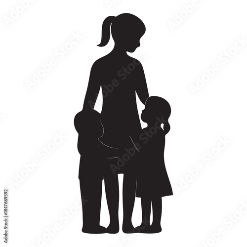 Loving mother embracing her two young children in a warm silhouette embrace.