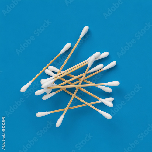 Cleanliness Essentials: An overhead perspective of cotton swabs, a simple yet essential tool for personal hygiene and care.  