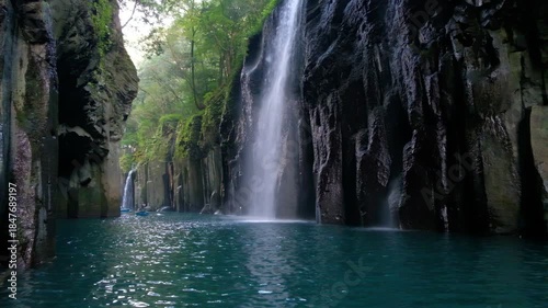 Takachiho Gorge in Takachiho, Miyazaki, Kyushu, Japan, Waterfall flowing into river in lush forest canyon landscape