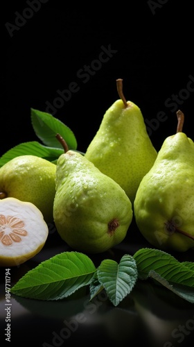 Fresh pears with leaves on black