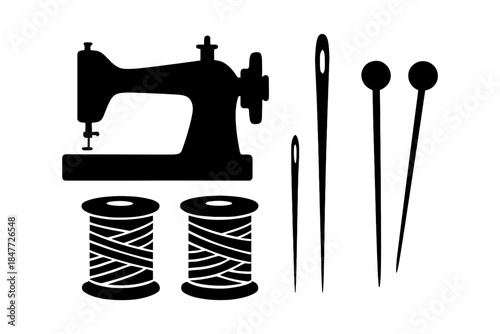 Sewing elements: vintage machine, needles, pins, spools.