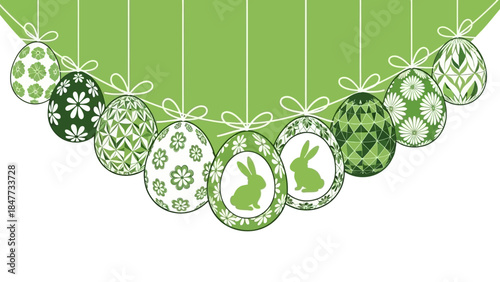 A row of nine green and white decorated Easter eggs with various patterns, including rabbits and flowers, hanging against a green background.