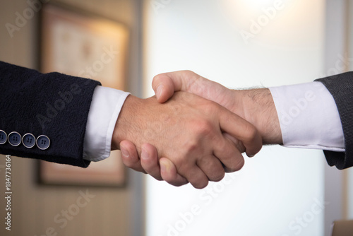 Business handshake with contract