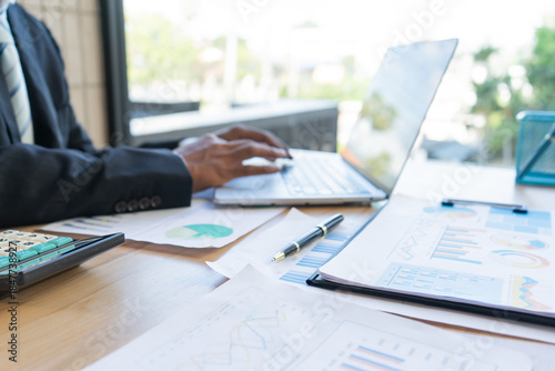 Experienced lawyer providing legal guidance in office, reviewing contracts, documents, finance, justice matters, advising clients during meetings and transactions professionally.