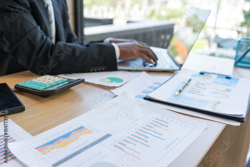 Experienced lawyer providing legal guidance in office, reviewing contracts, documents, finance, justice matters, advising clients during meetings and transactions professionally.