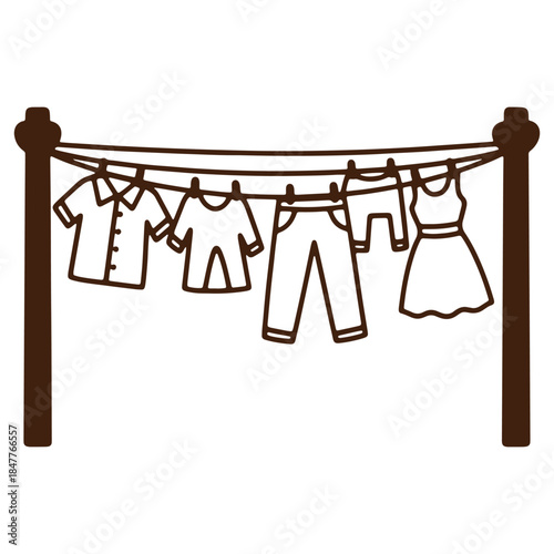 Clothesline with various garments hanging outdoors including shirts pants and a dress symbolizing laundry day and fresh air drying