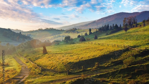 Fotografía Agricultural fields on hills at sunrise