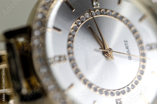Obraz na płótnie Scorpion hour and minute hands with stones inside the watch dial, macro