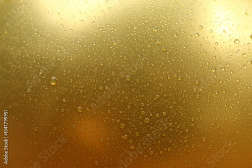 Wallpaper Mural A golden abstract background with water droplets and dewdrops on the surface. It gives a fresh, moist, and cool impression with golden yellow tones. Torontodigital.ca
