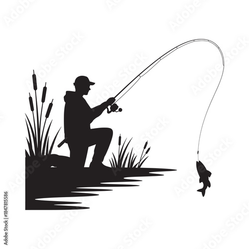 Silhouette of a fisherman with a caught fish by the reeds