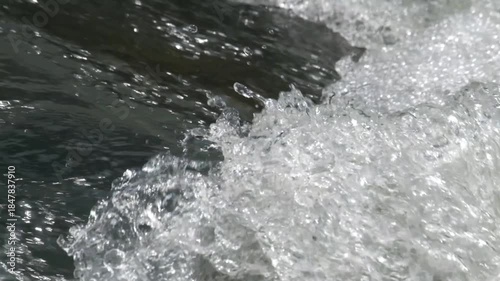 Close up of a clear river splash. Fast flowing river water. Ecological and environmental concept. Realtime footage, 4K