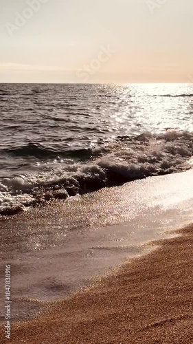 Vertical Ocean View with Sun Reflection on Water at Sunset