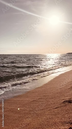 Vertical Ocean View with Sun Reflection on Water at Sunset