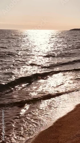 Vertical Ocean View with Sun Reflection on Water at Sunset