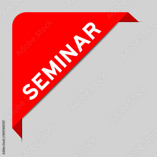 Red color of corner label banner with word seminar on gray background