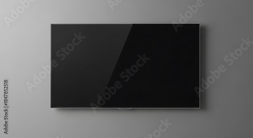 Sleek Black Screen Display on Minimalist Gray Wall.