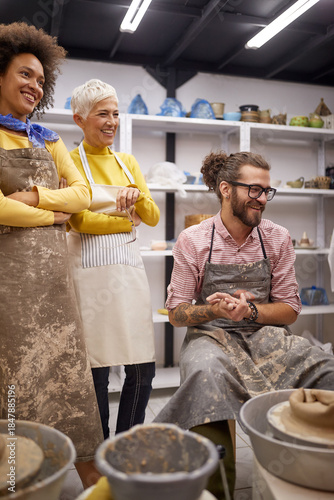 Happy group of people on handmade pottery making workshop. Creative, hobby ,workshop  concept