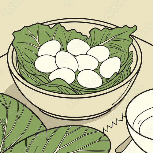 Bowl of green leaves and white eggs on table food