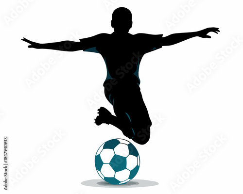 Silhouette of a soccer player jumping and kicking a ball