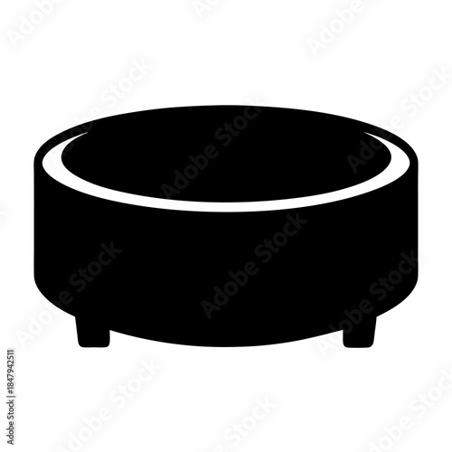 Simple black and white image of a short round ottoman with small legs