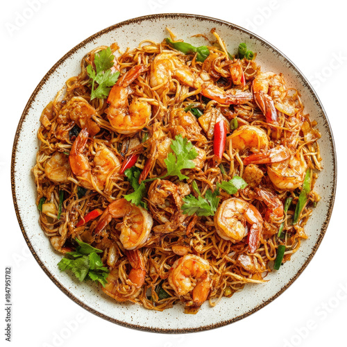 Overhead View of a Plate with Prepared Shrimp Noodles Featuring Green and Red Vegetable Garnishes in a Brown and White Ceramic Plate