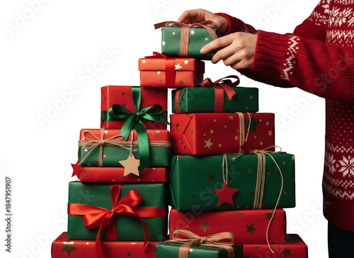 Person in Red Christmas Sweater Stacking Colorful Wrapped Gift Boxes